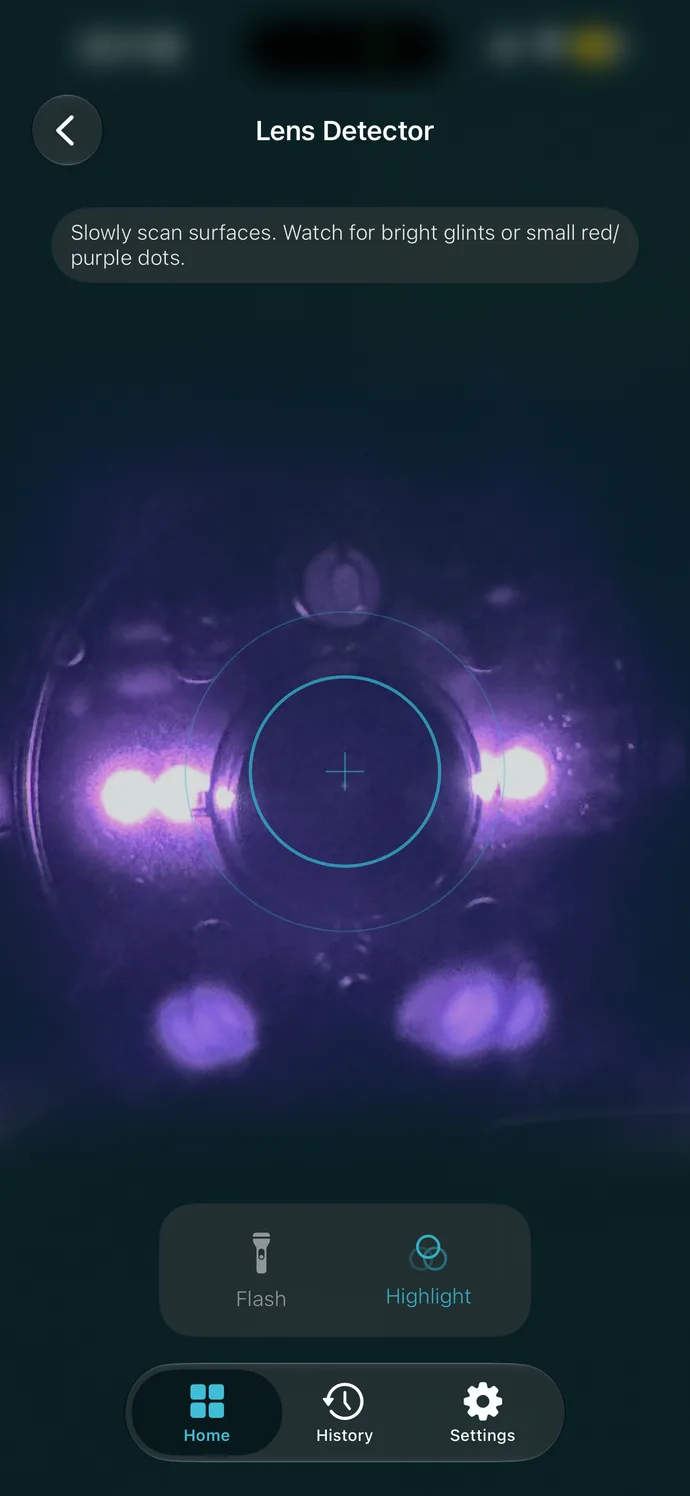 Lens Detector showing a night-vision camera's infrared LEDs glowing purple around its lens.